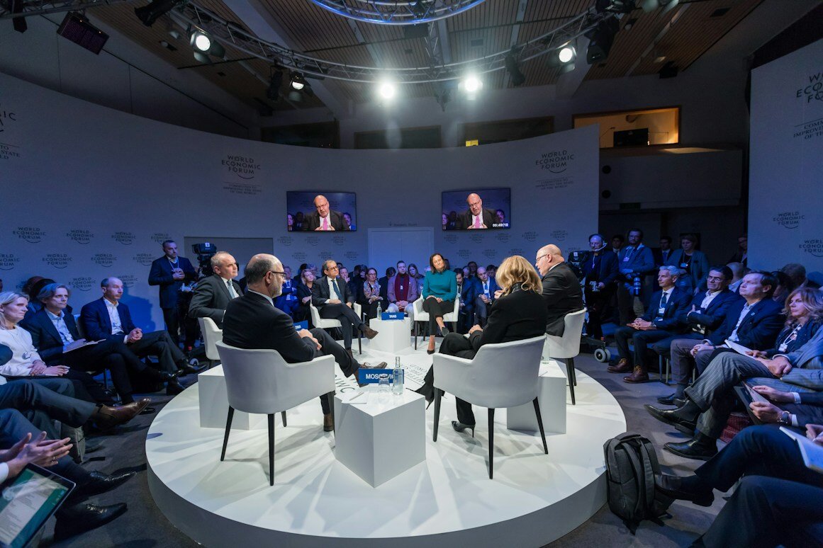 Panel discussion on stage in front of an audience